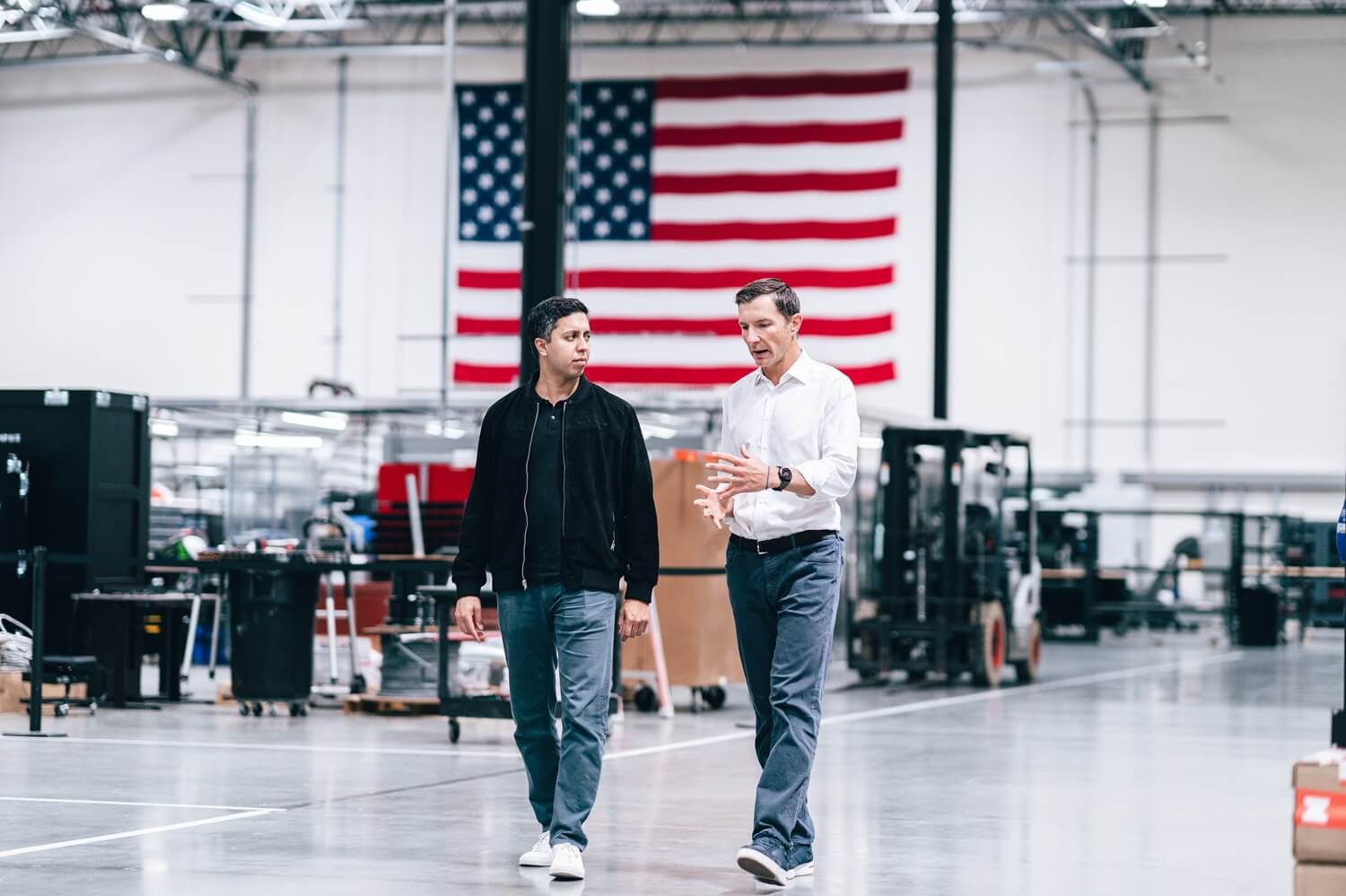 Chairman John Jovanovic walking one factory floor with Karan Kunjur