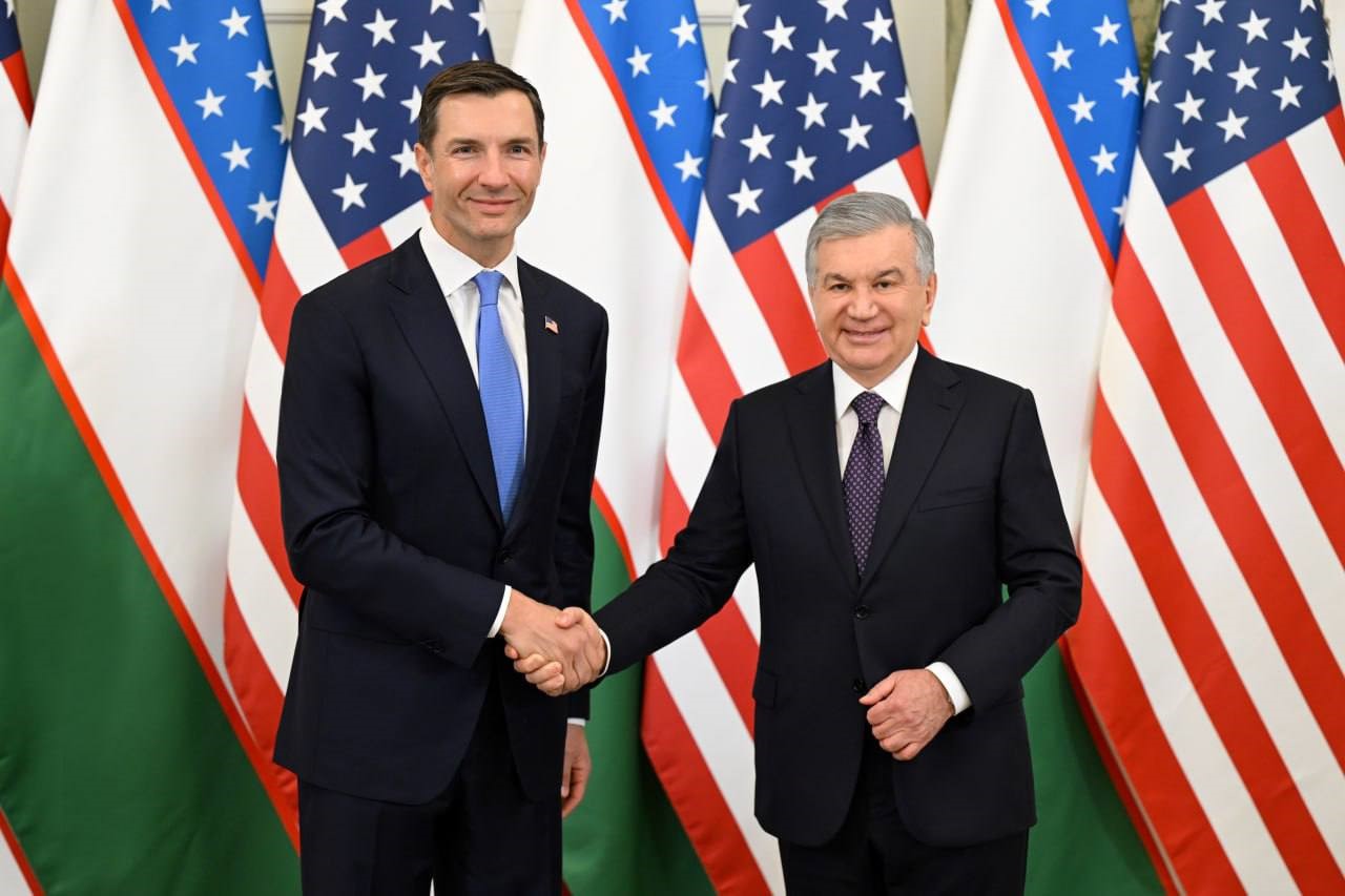 Chair shaking hands with leader