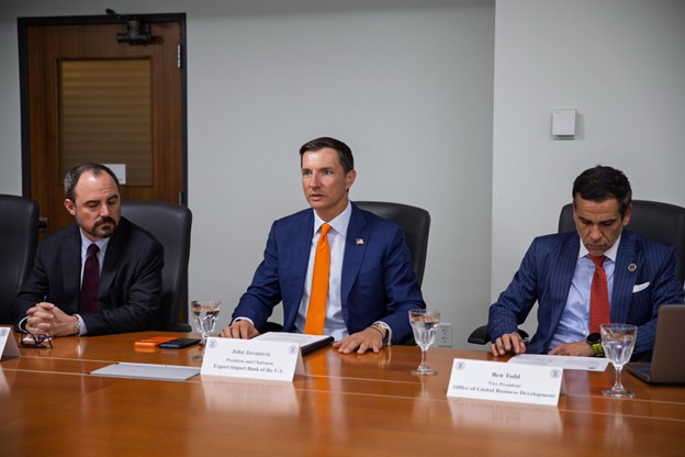 Chair meeting at table with leaders