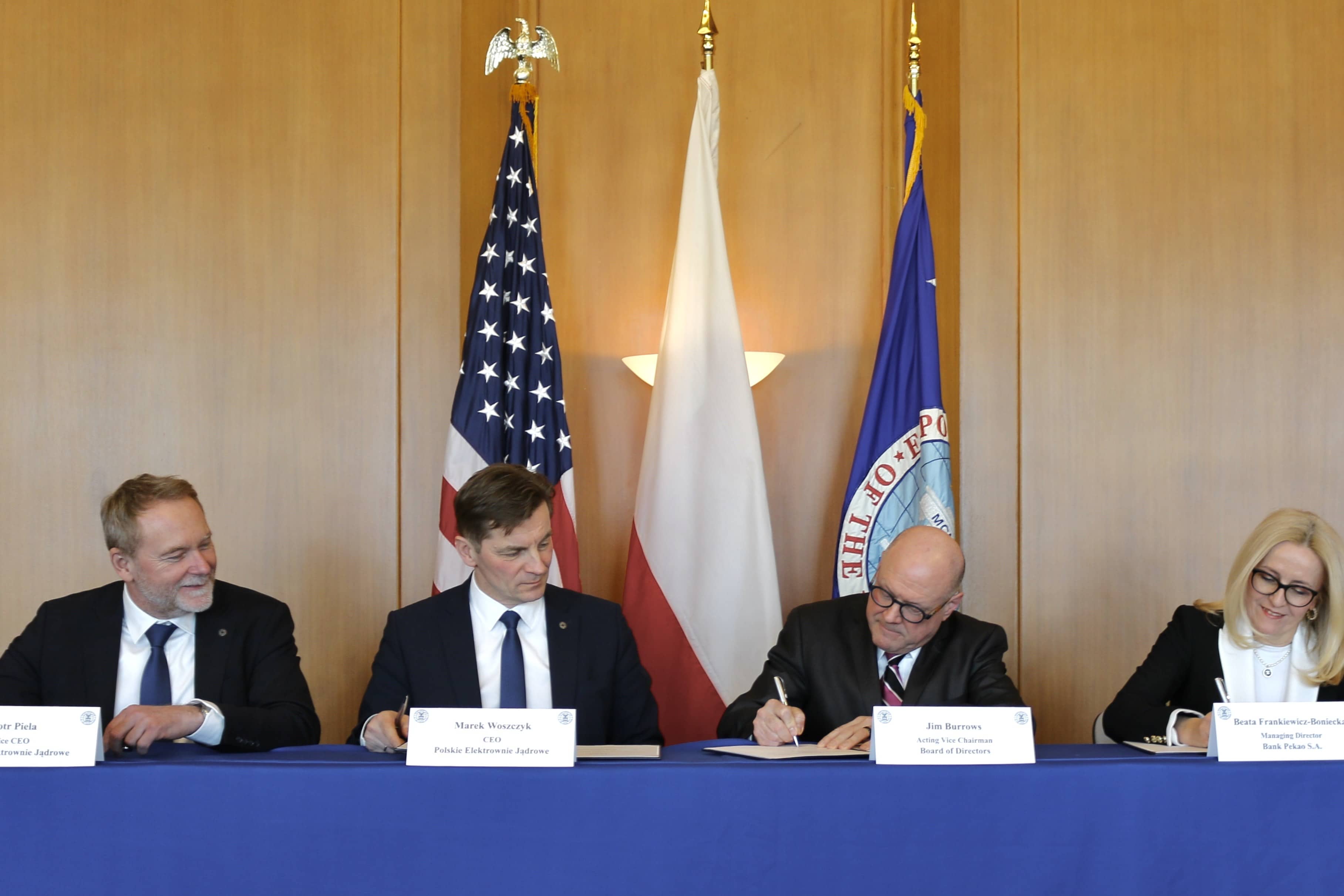 Dignataries on stage signing