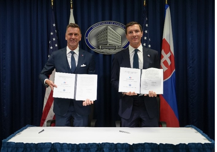 Posing with signed agreement