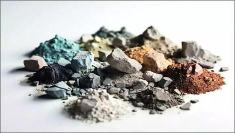 A colorful collection of different minerals in pulverized piles